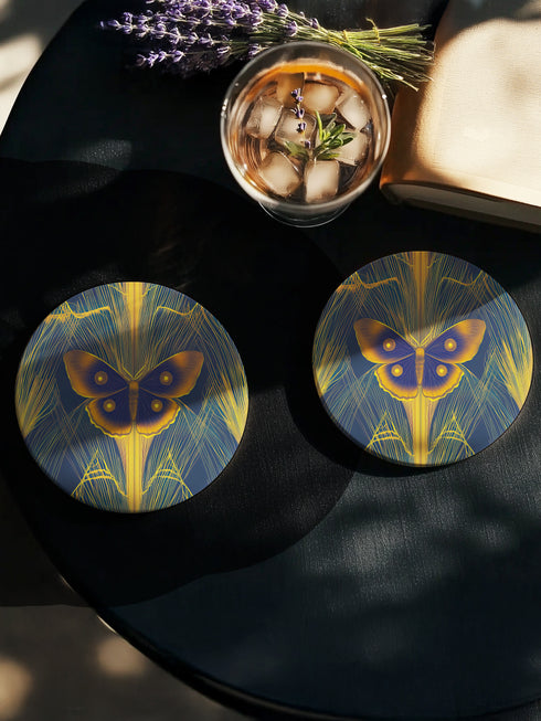 Round ceramic coaster featuring golden Luna moth illustration on dark green background with rose gold linear patterns. Cork-backed, 4-inch diameter. Perfect for vintage nature and gothic decor enthusiasts.
